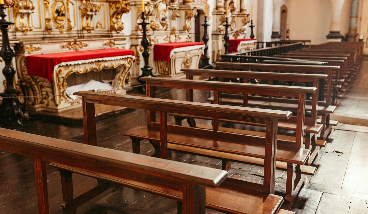 Rows of empty wooden pews