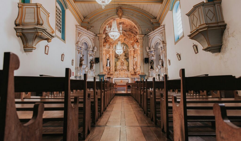 A wide-angle view from the center aisle of a historic church