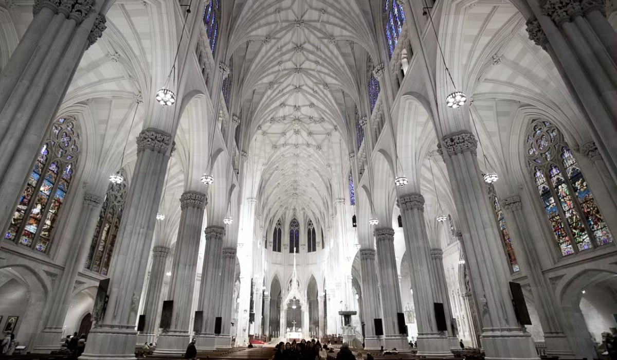 low-angle view of the grand interior of a Gothic-style cathedral