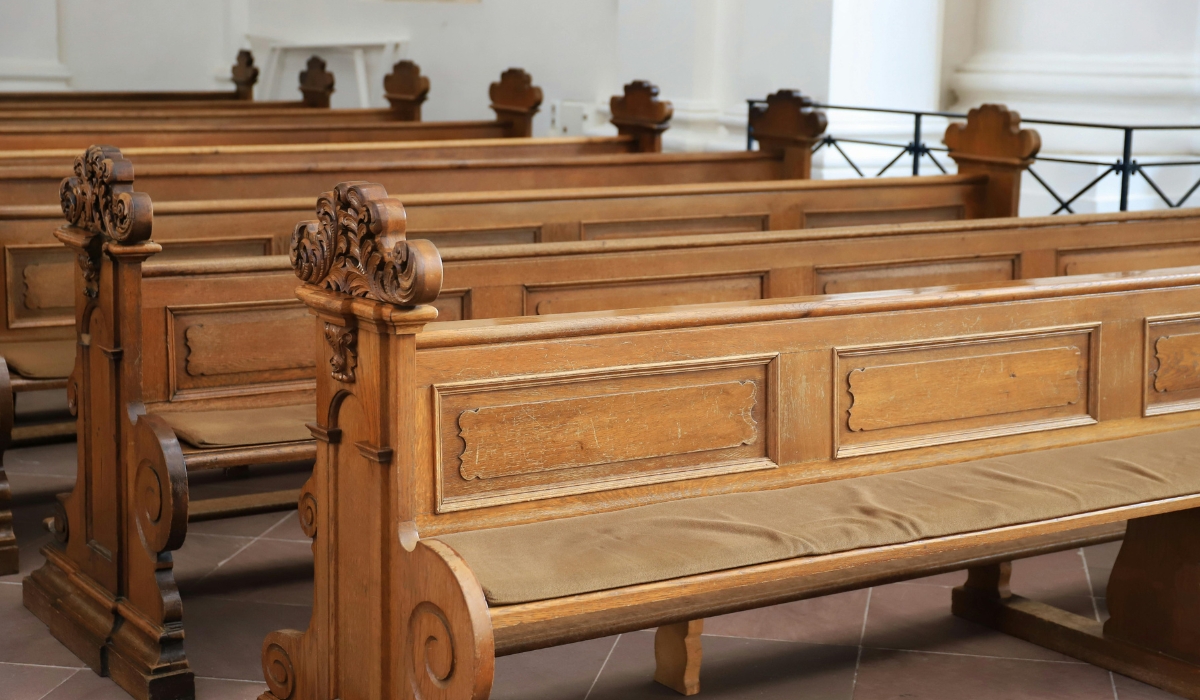 light-colored wooden church pews