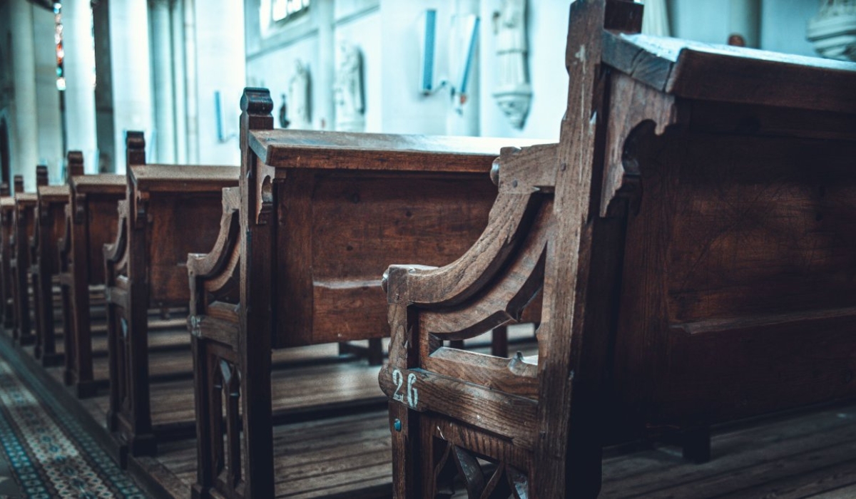 Rows of vintage wooden church pews 