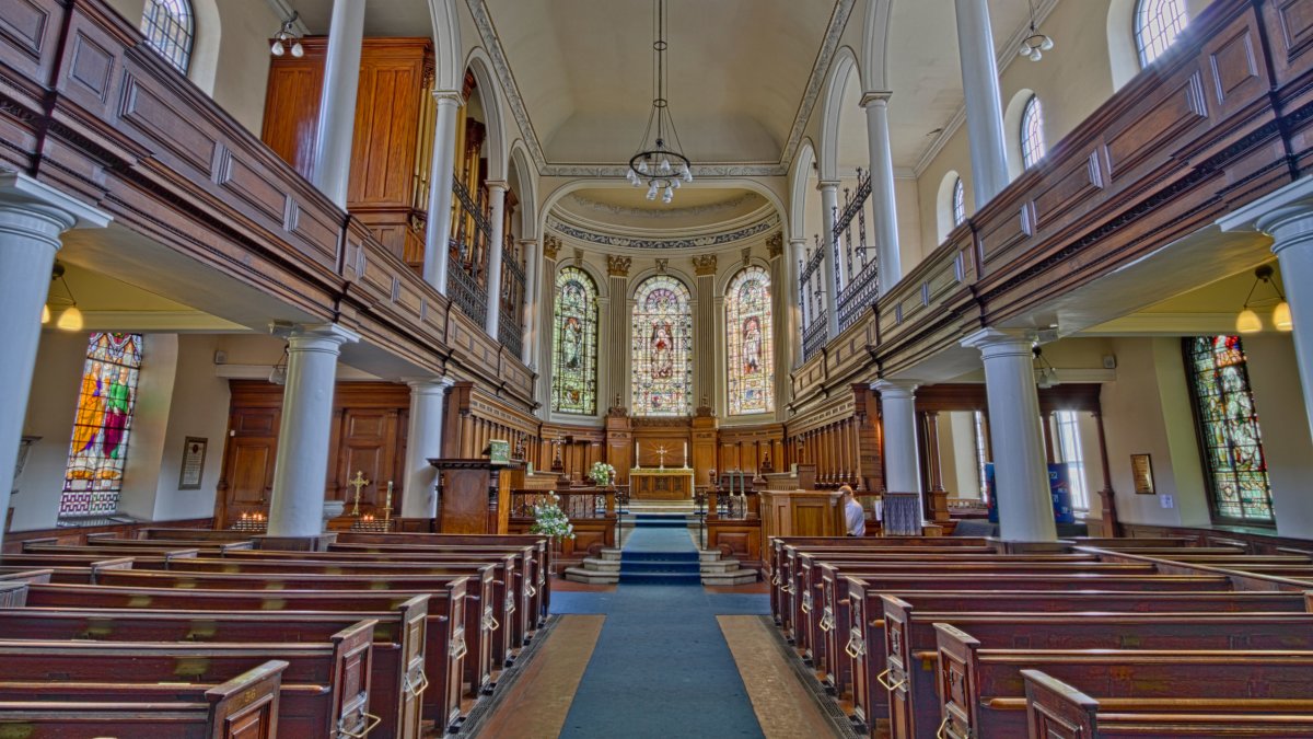 Interior of a historic church showcasing ornate architecture and masonry details