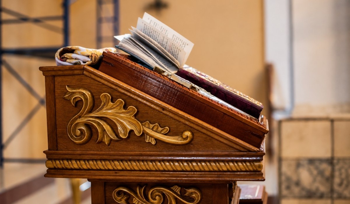 ornately carved wooden lectern
