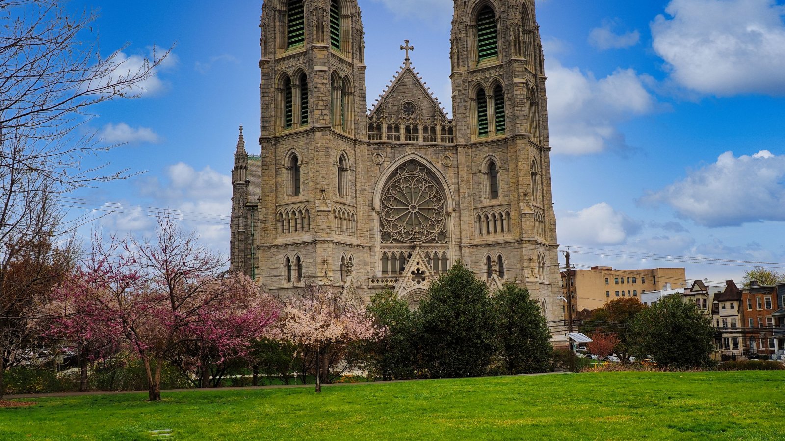 Frontal view of Newark's Cathedral Basilica of the Sacred Heart with blossoming spring trees